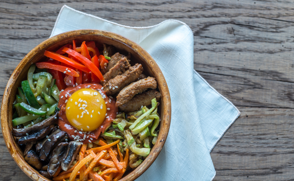 Bowl of bibimbap on the wooden table