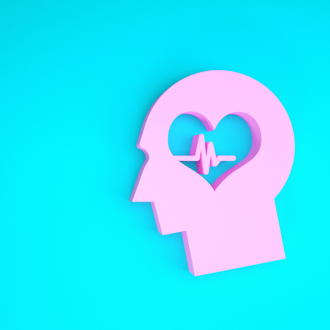 person head cut out on a blue background with a heart line through the brain